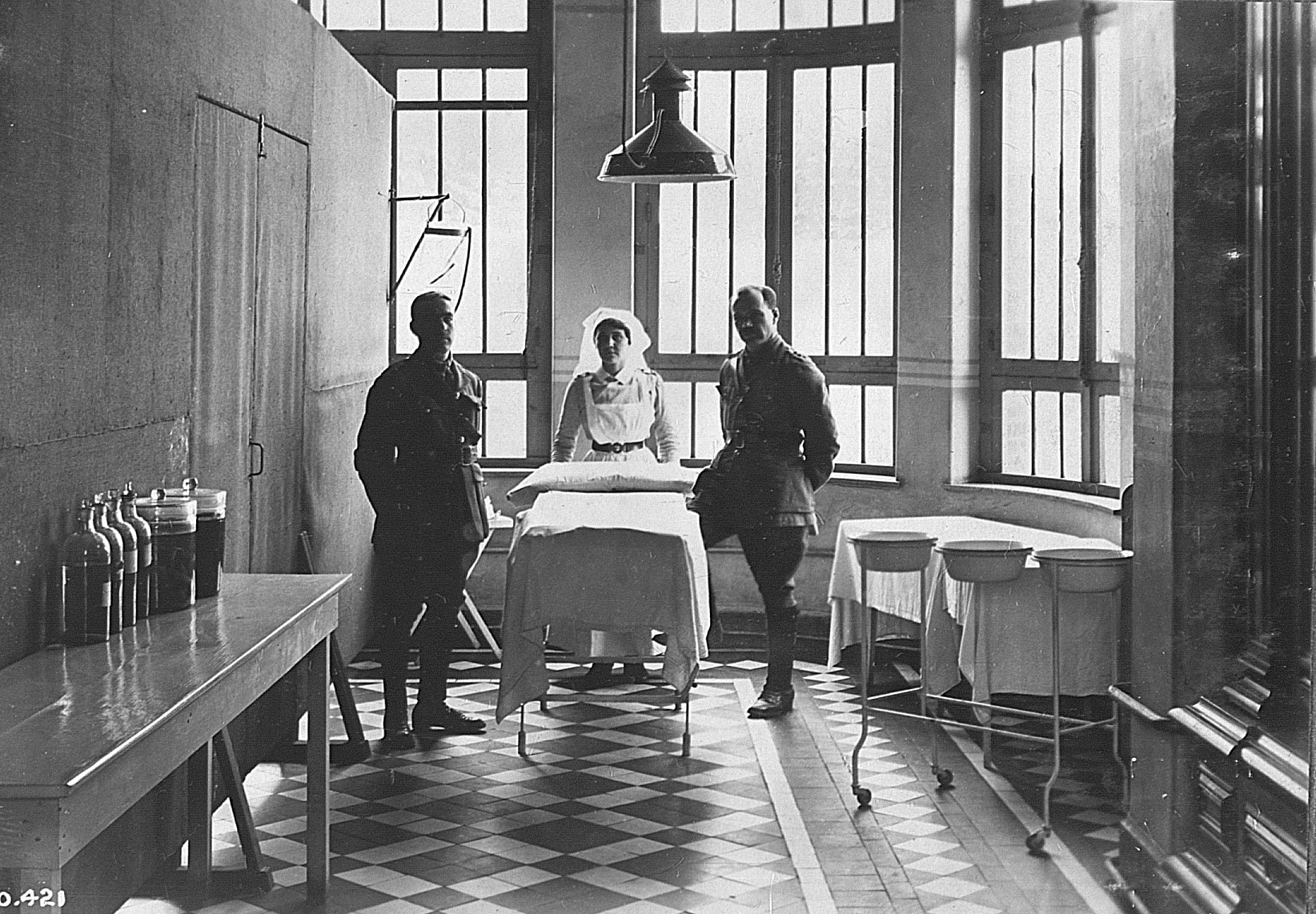 A Canadian Army Medical Corps nurse with two Canadian soldiers, a First World War official Canadian war photograph