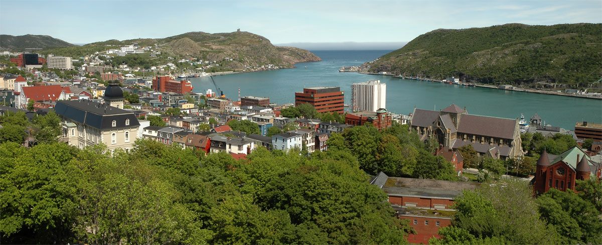 St. John's, Newfoundland, viewed from the harbour, showing the densely built waterfront and Signal Hill in the background