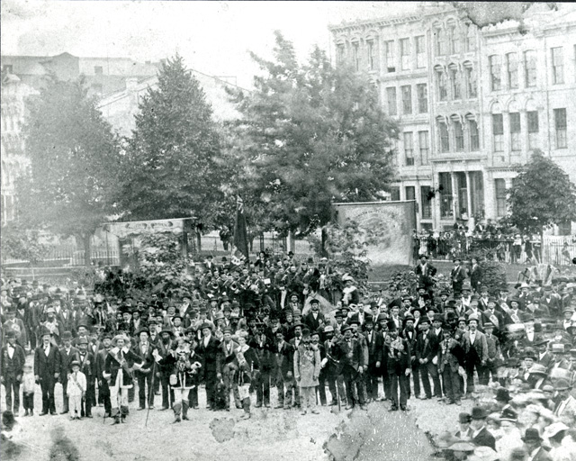 Orange parade passing through Gore Park in the 1870s