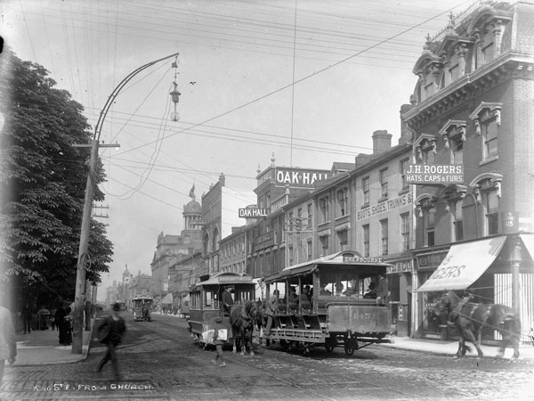 A Toronto Street Railway Company horse-drawn streetcar on King Street East, viewed from Church Street, circa 1890