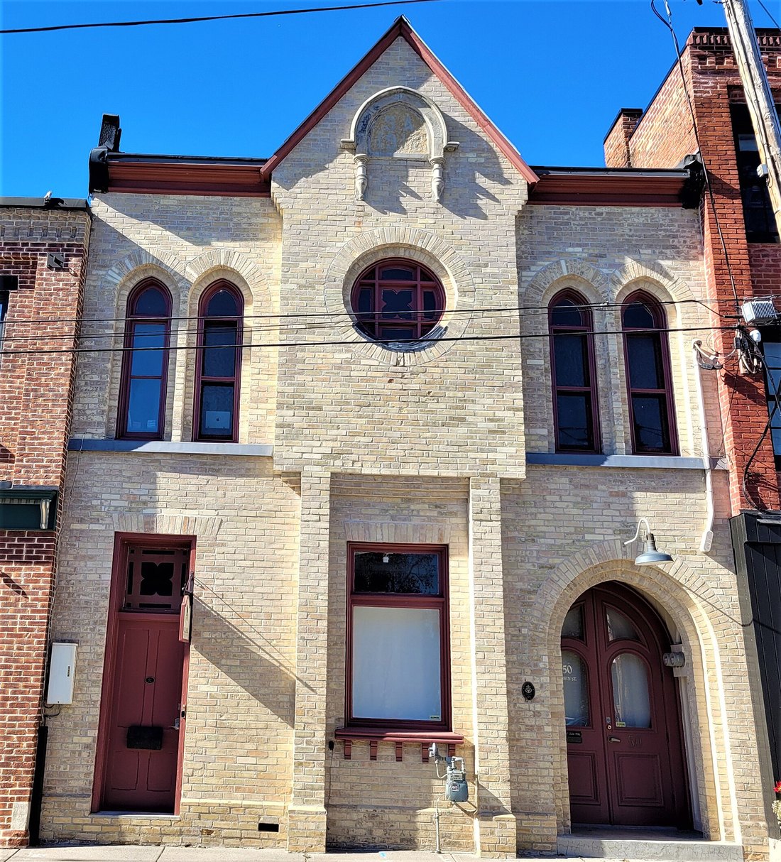 The brick Orange Hall at 50 John Street, Port Hope, Ontario, with arched windows and a gabled front